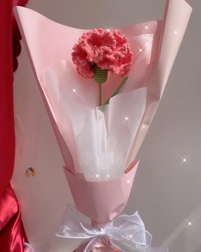 single carnation wrapp with greenery